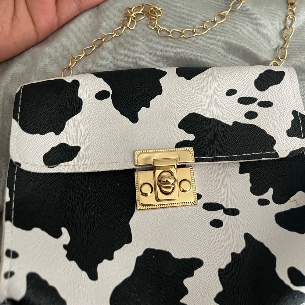 Clutch cow print purse